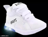 White sneakers with black lettering, lace-up front