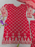 A red traditional dupatta set with an embroidered designer party wear kurta and sharara, paired with a matching scarf
