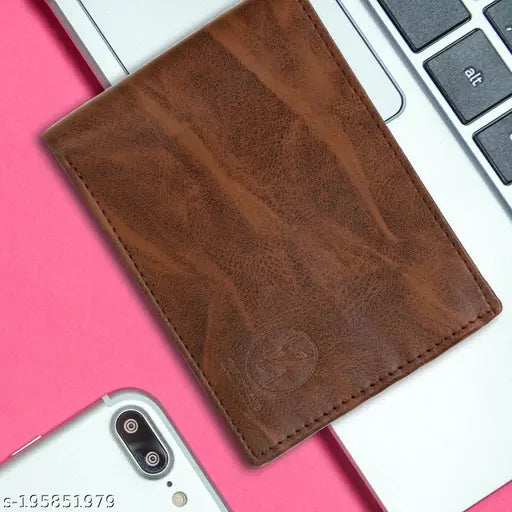 Brown faux leather slim wallet with textured pattern, ideal for men's essentials. Includes 5 card slots, 2 pockets, 1 zipper coin pocket, and 3 compartments for notes. Made by Zoster® in India