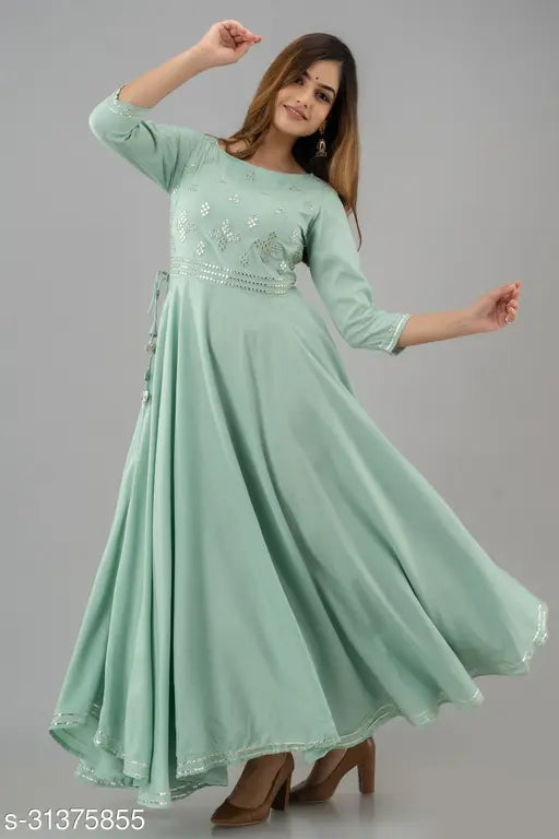 Embroidered rayon kurtis, three-quarter sleeves, mirror work design. Indian women's fashion on mannequin
