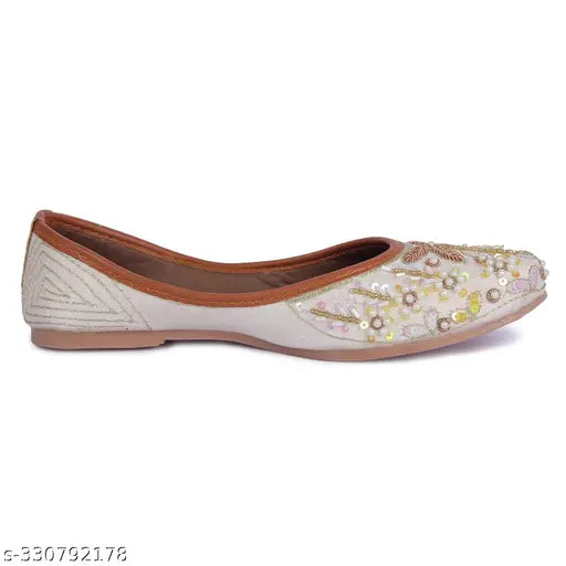 Synthetic bellies and colorful Punjabi juttis for women, embellished slip-ons in sizes IND-4 to IND-9 from NIHARIKA, India