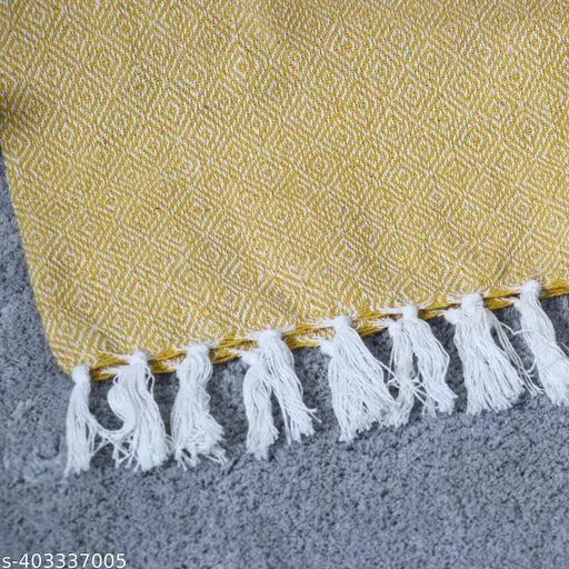 Yellow cotton sofa throw, stitched fringe
