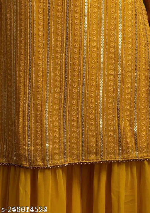 Yellow and gold embroidered sari with matching blouse