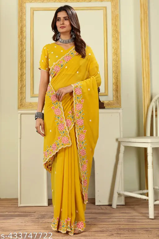 Georgette yellow sari with embellished embroidered borders and matching blouse