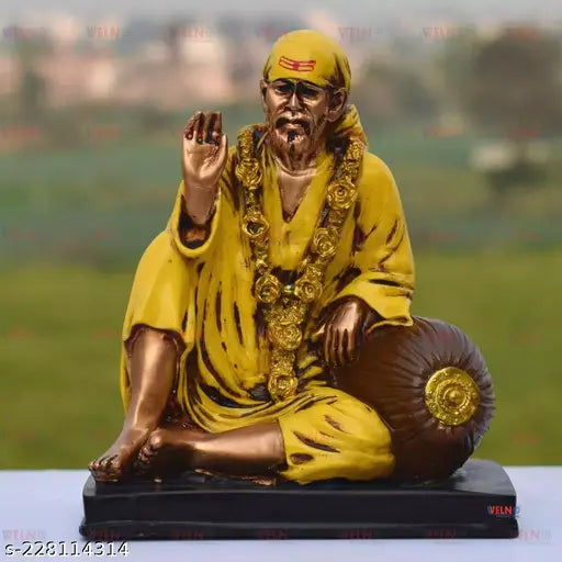 Yellow resin Sai Baba Idol, handcrafted by skilled artisans for spiritual home decor or office, Vastu Feng Shui-friendly, ideal gift for various occasions, India origin. (14cmL x 16cmH x 9cmB, net quantity: 1)