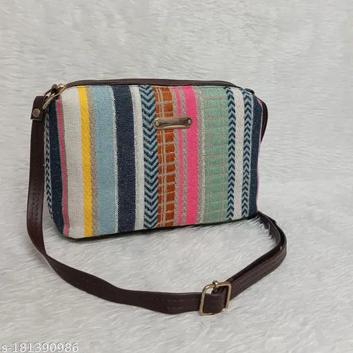 Colorful striped fabric with patchwork design, appliqued on purse, brown leather strap