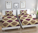 White single bed with printed cotton sheets and brown pillow covers