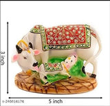 Multicolor handcrafted Polyresin Kamdhenu Cow and Calf statue for home decor or festive gifting, symbolizing prosperity and love