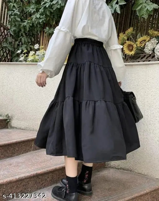 Rayon midi skirt, solid pattern, free size. Elegant, comfortable ethnic skirt on display, suitable for light occasions. Style with a top for complete look." (102 characters)