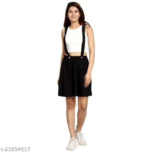 Black cotton dungaree mini skirt, feminine design for women and girls. Wear with white shirt or nude heels