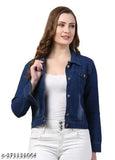 Girl in white shirt, standing with hands in pockets, wearing cropped blue jean jacket
