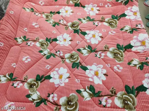 Floral print quilt with a white floral border, 60 x 80 inches