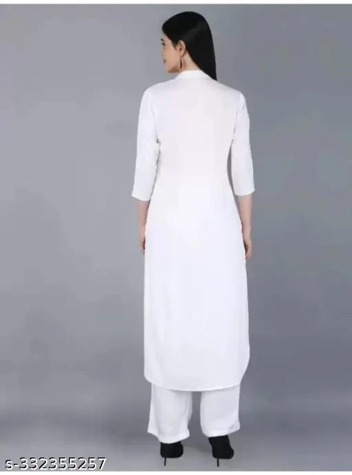 White rayon Women's modern kurta with rayon Palazzos, three-quarter sleeves, trendy ethnic set for special occasions. Available in M, L, XL, XXL sizes. Indian origin