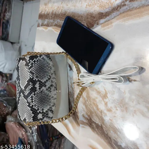 Faux snakeskin purse on marble table