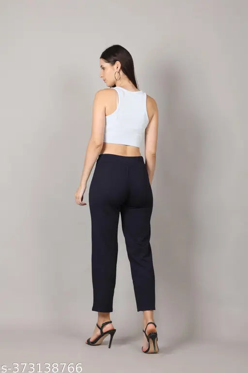 A person modeling high rise trousers in a blue color, likely denim, suitable for fashionable women and girls, available in a pack of two