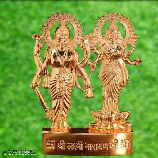 Shiny brass metal deity idol with Lord Ganesha and Goddess Lakshmi