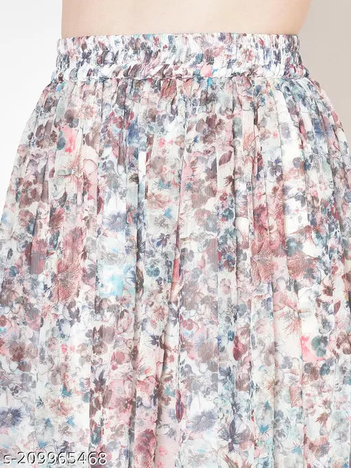 Multicolored chiffon flared midi skirt with printed net pattern, elastic waistband and slip-on closure. Available in sizes 26, 28, 30, 32, 34 (waist 26in - 34in, length 28in). Handcrafted Indian fashion