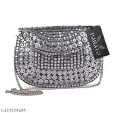 Silver metal bag with dot pattern, sling bag style, suitable for parties
