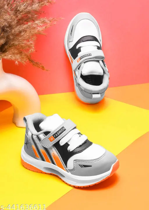Black and white sports shoes with velcro closures