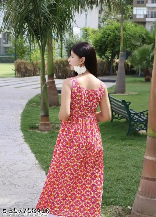 Pink maxi dress, 100% cotton, floral print, spaghetti straps, adjustable waist.