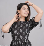 Trendy, alluring black kameez with flared sleeves and embellished waistband
