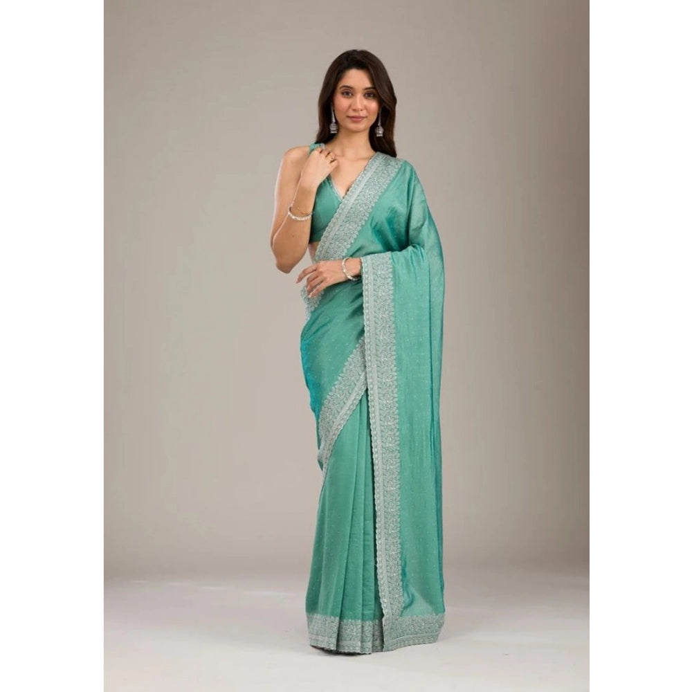 Light green silk embroidered saree with unstitched blouse (5.5mtr), traditional Indian wear on display
