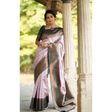 Light-pink soft lichi silk printed saree with unstitched blouse, traditional Indian women's wear on display