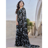Black chiffon printed saree with unstitched blouse, vibrant design on display