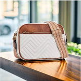 Women's white PU leather zipper sling bag with medium size, featuring durable design for everyday use