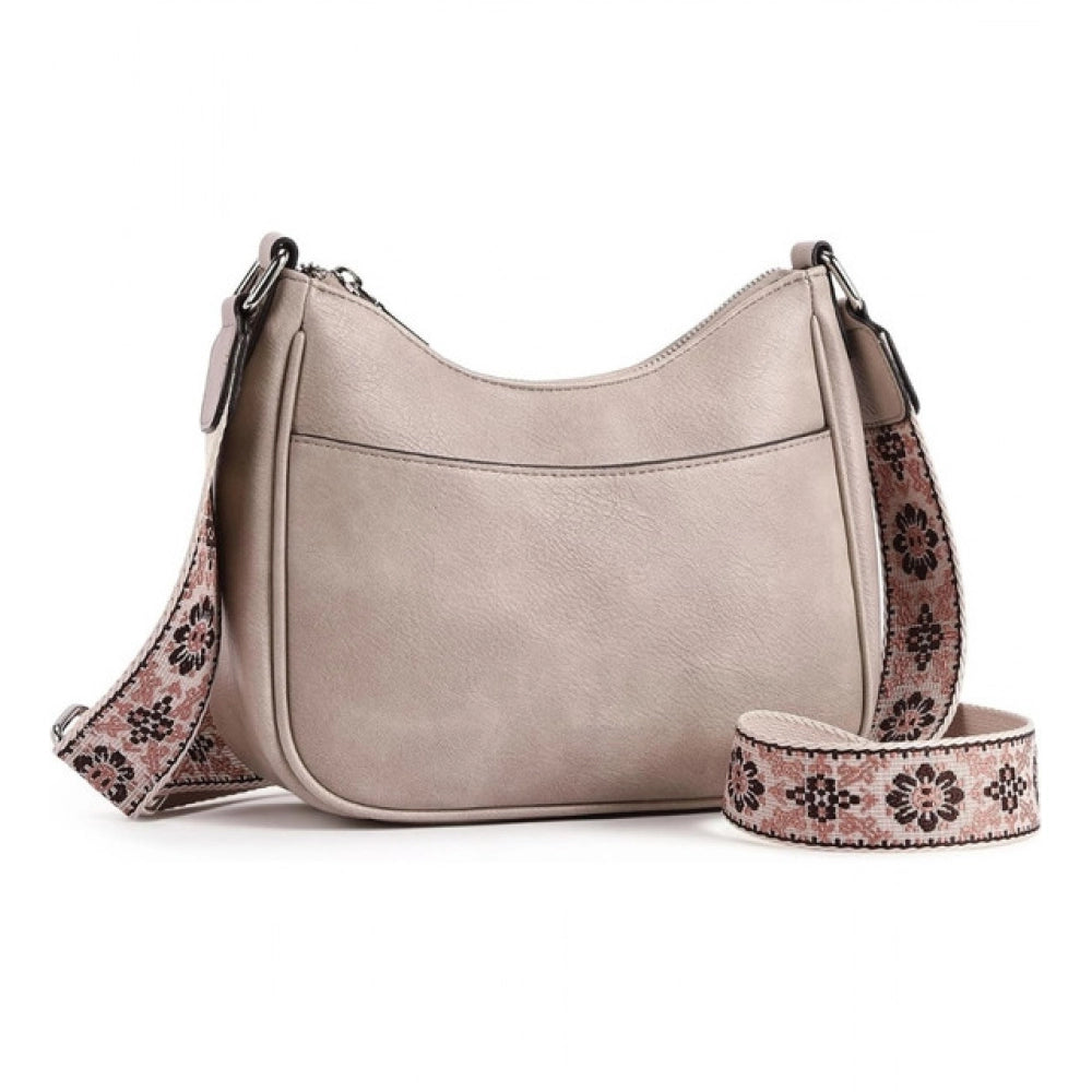 Beige PU leather sling bag with zipper closure, medium size for women's fashion accessories