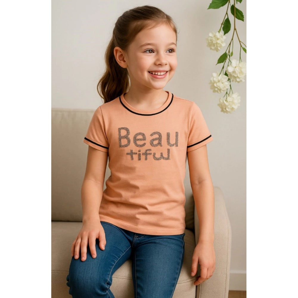 Girls cotton printed round neck t-shirt, sandal beach color on model