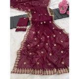 Red georgette embroidered saree with unstitched blouse, intricate floral design on display rack