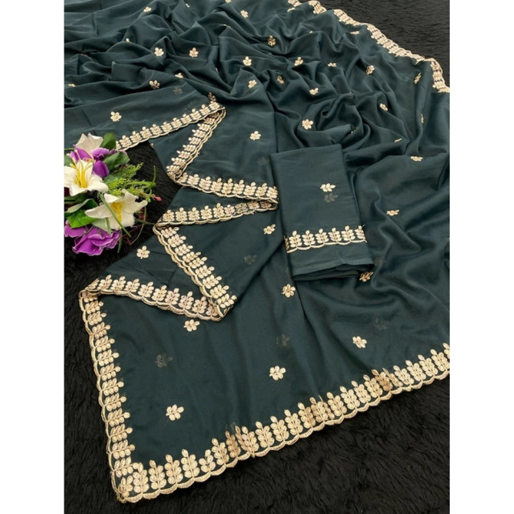 Teal georgette embroidered saree with unstitched blouse, intricate detailing