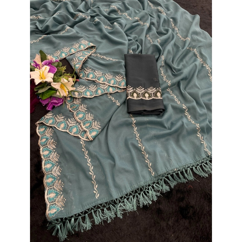 Blue Georgette embroidered saree with unstitched blouse (5.5Mtr) - intricate patterns on display