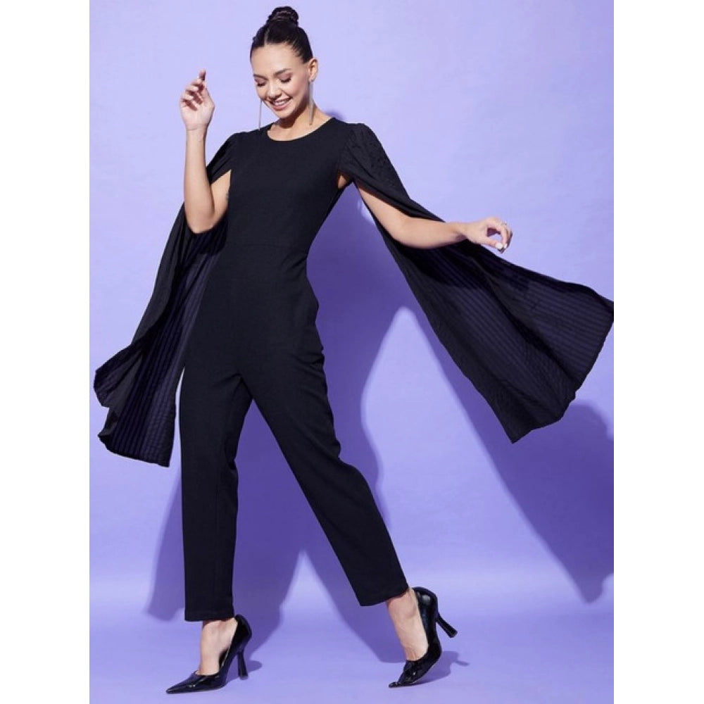 Black polyester solid cape sleeve jumpsuit for women on model, concealed zip closure