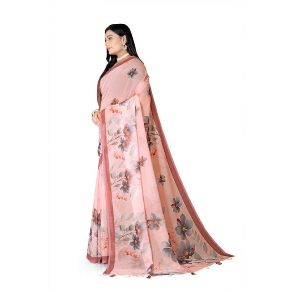 Peach georgette floral printed saree with unstitched blouse, vibrant floral design on display