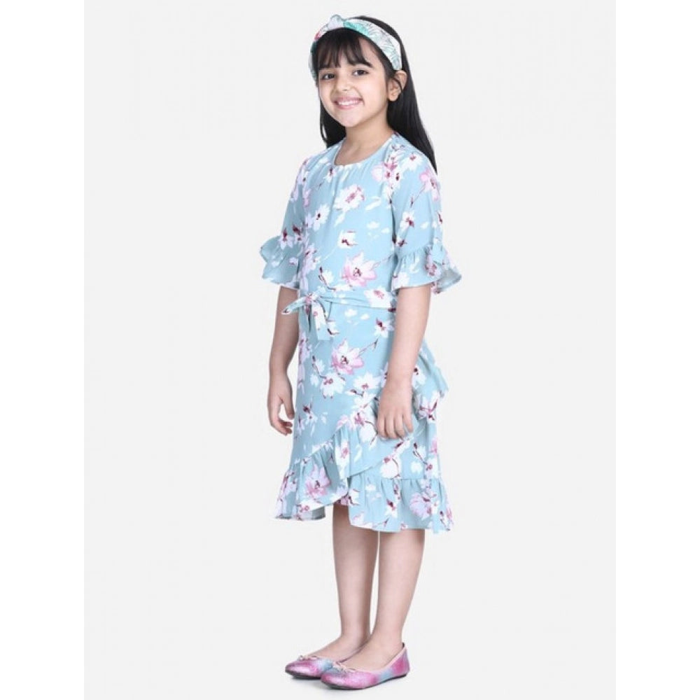 Turquoise blue floral bell sleeve dress for girls, polyester crepe material, below knee length, round neck, on mannequin