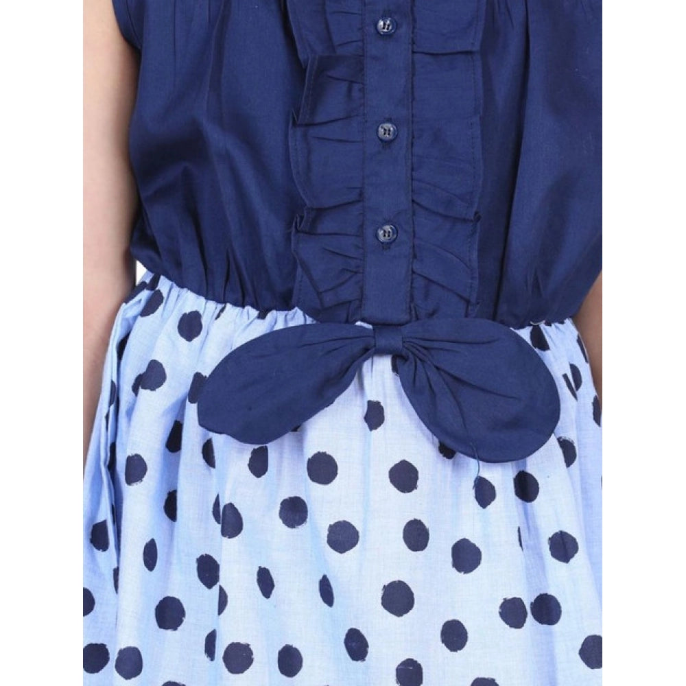 Blue denim polka sleeveless dress with round neck and button closure on model, cotton lining for comfort