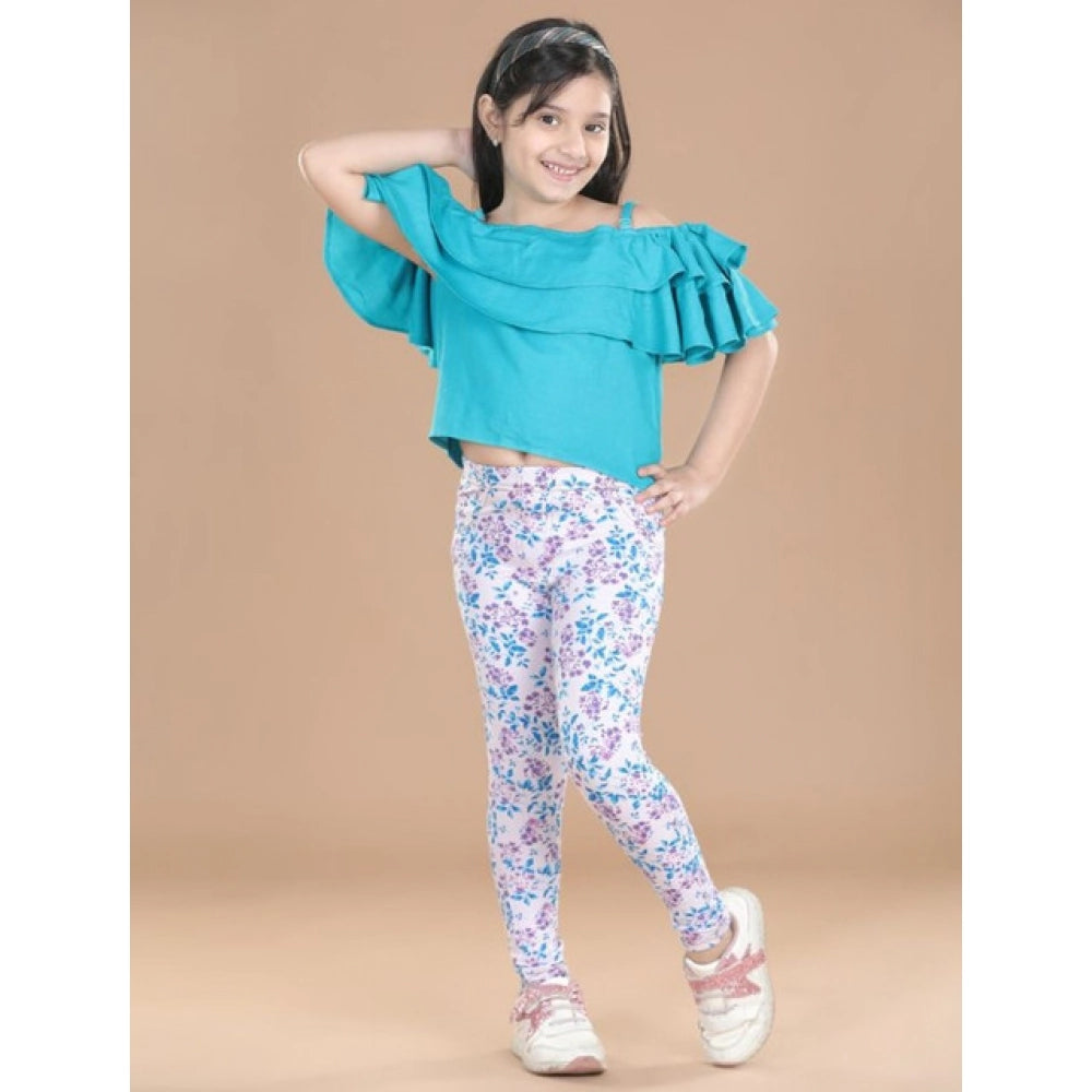 White-Turquoise Blue cotton lycra girl's floral elasticated jeggings, close-up view with floral pattern detail