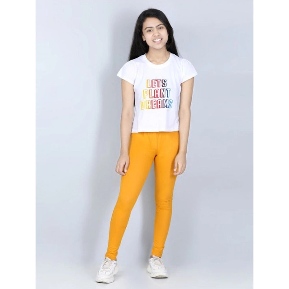 Mustard Cotton Lycra girl's elasticated jeggings, solid pattern, casual wear for active kids