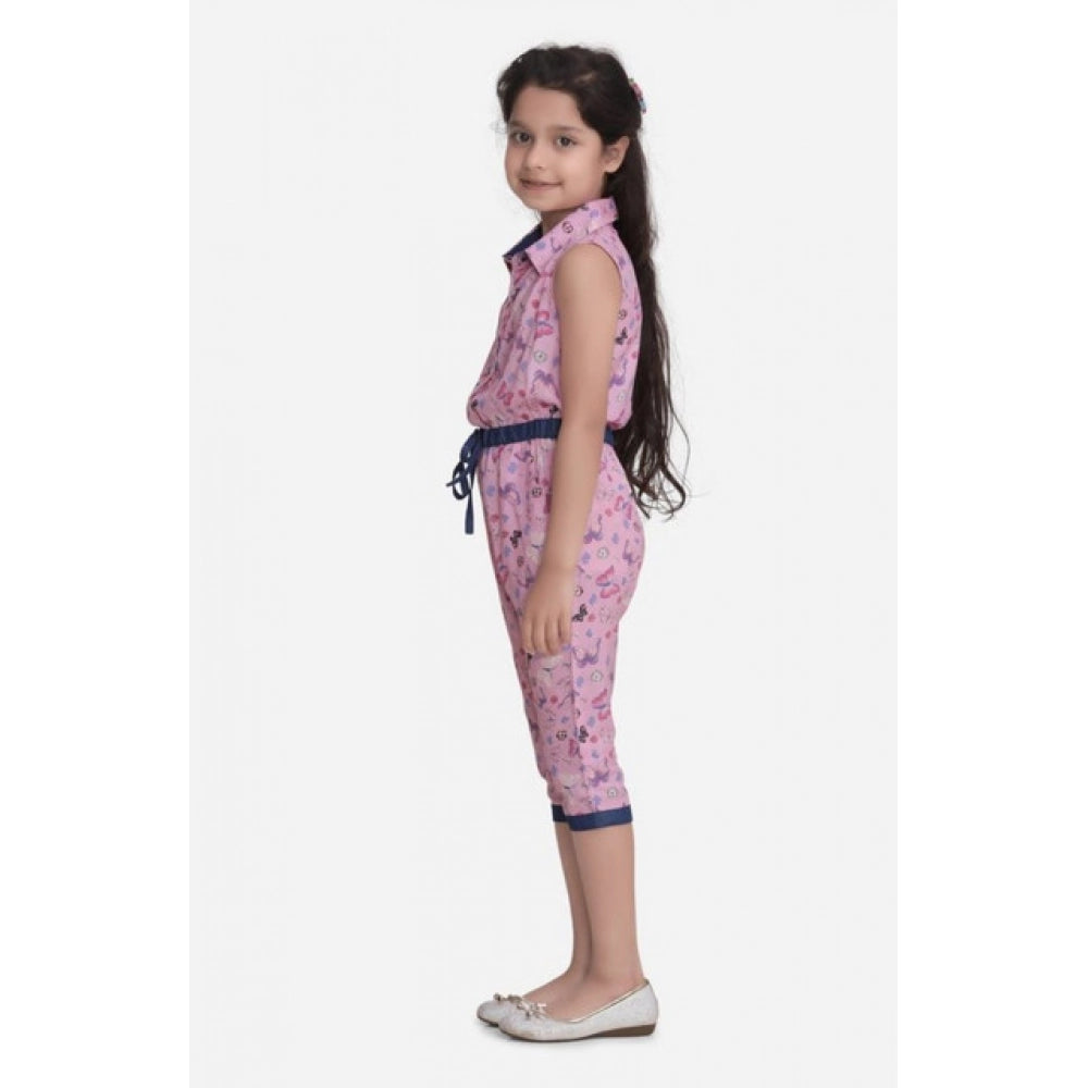 Pink cotton printed sleeveless jumpsuit for girls, shirt collar neckline on a colorful backdrop