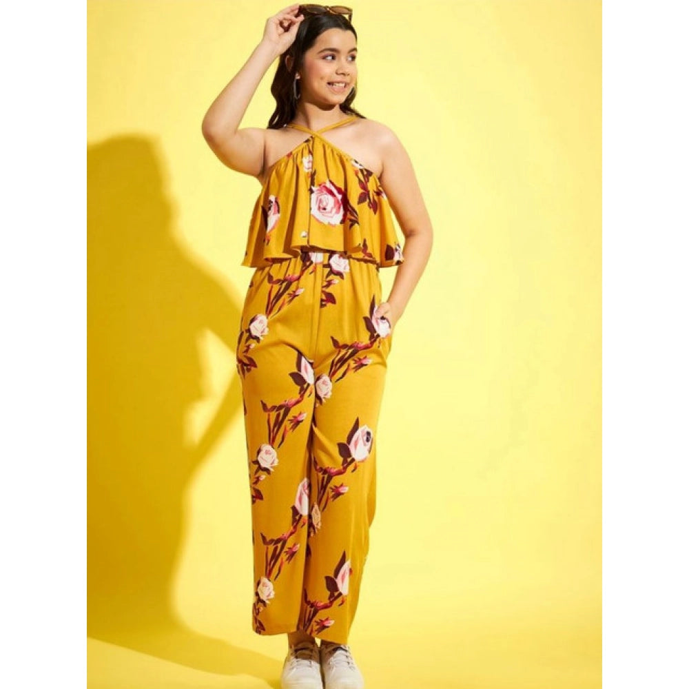 Mustard polyester crepe floral sleeveless jumpsuit for girls - vibrant floral pattern on display stand