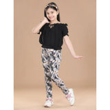 Black cotton floral elasticated jegging and top set for girls, featuring a floral pattern and shoulder strap top