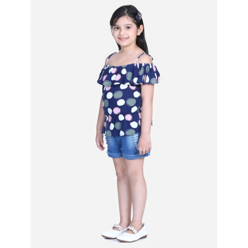 Navy Blue rayon cold shoulder top with denim shorts, solid pattern on display rack
