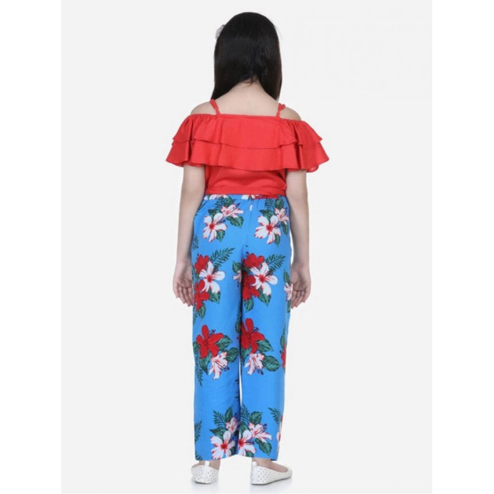 Multi-colored rayon floral girls' top & trouser set, short sleeve, square neck, vibrant floral pattern on display