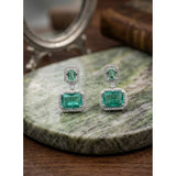 Green brass silver plated drop earrings for women, jewelry accessory on display stand