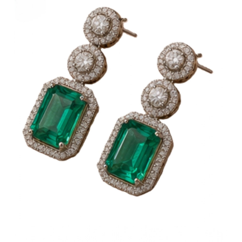Women's brass silver plated green drop earrings, delicate jewelry piece on display