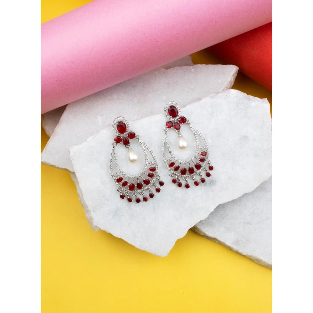 Women's red brass silver plated chandbali earrings, stylish jewelry accessory on display