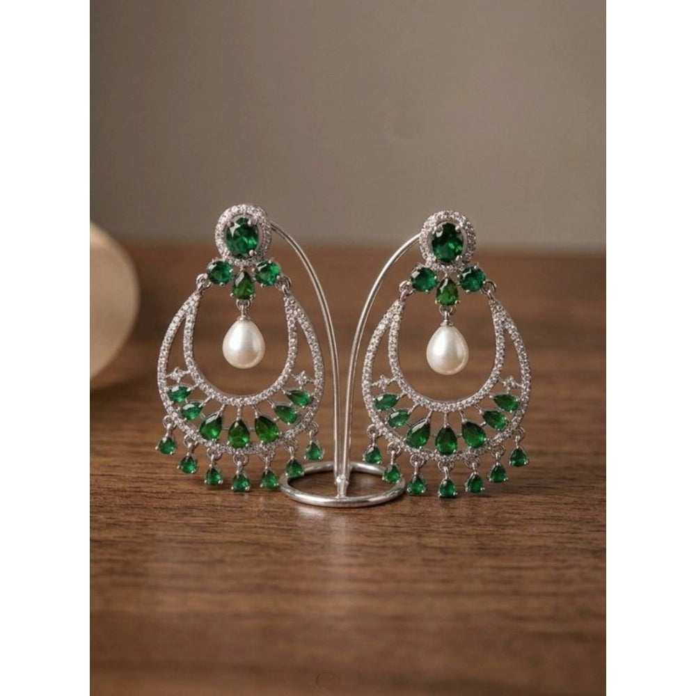 Green brass silver plated chandbali earrings for women, intricate design on display