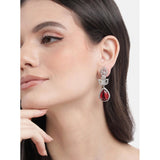 Women's brass silver plated red drop earrings, shiny jewelry accessory on display